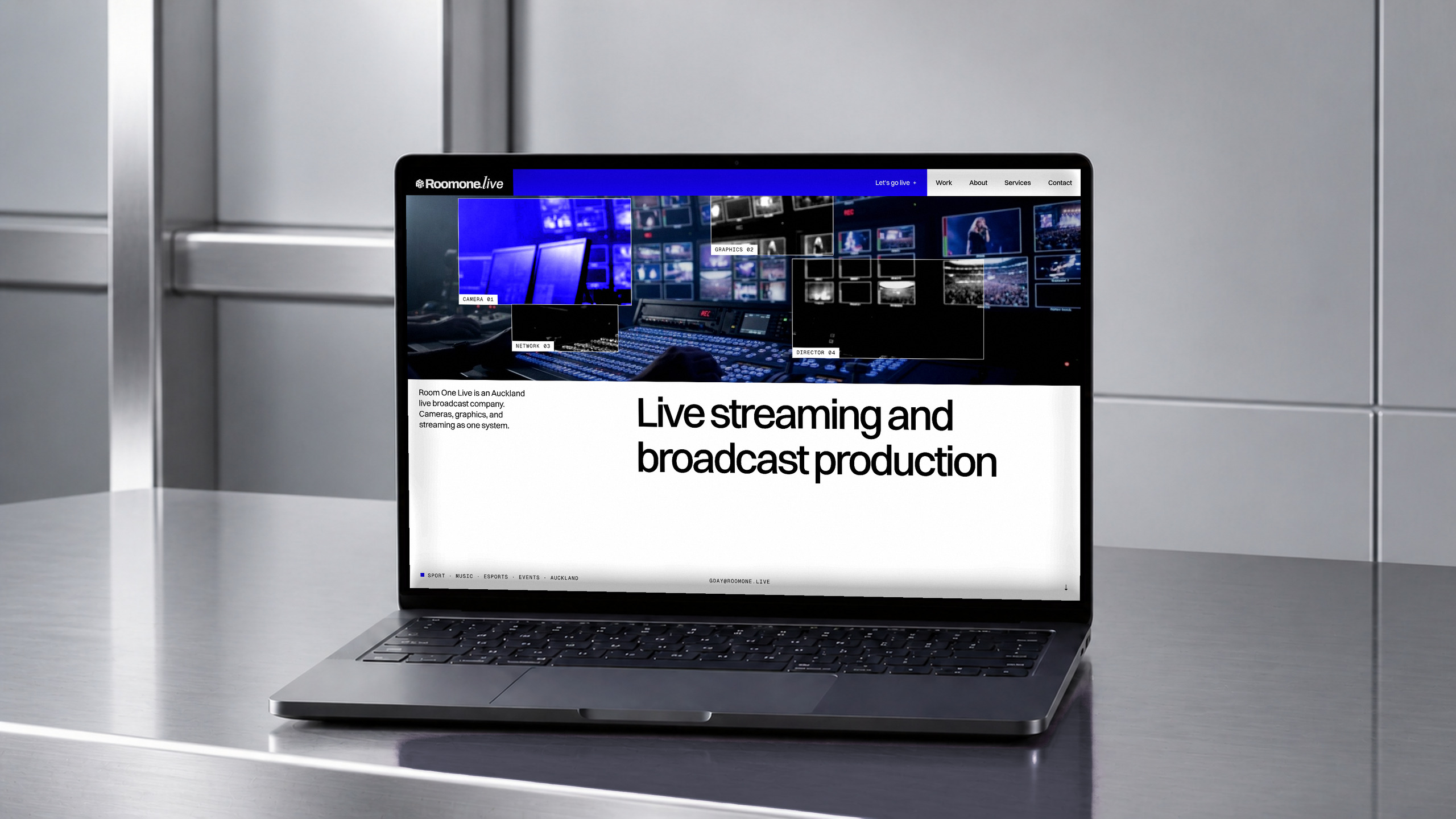 Room One Live website on a laptop